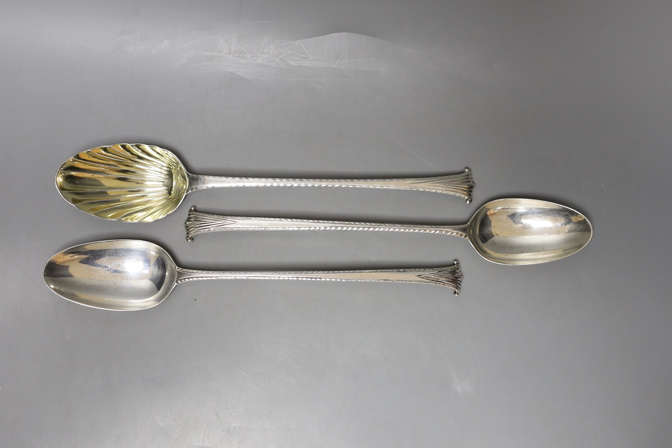 Three George III silver Onslow pattern basting spoons, two with pinched marks, one dated London, 1780, approx. 29.5cm, 10oz.